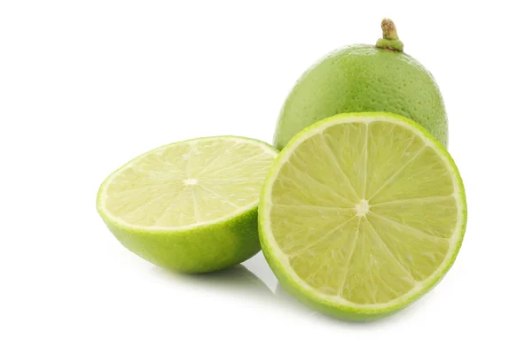 Lime fruit and a cut one — Stock Photo, Image