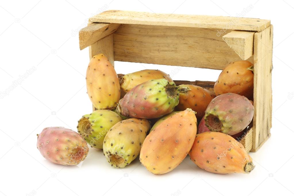 fresh colorful cactus fruit in a wooden crate