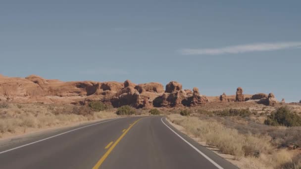 Driving On Empty Road Through Amazing Arches National Park In Usa On Sunny Day — Stock Video