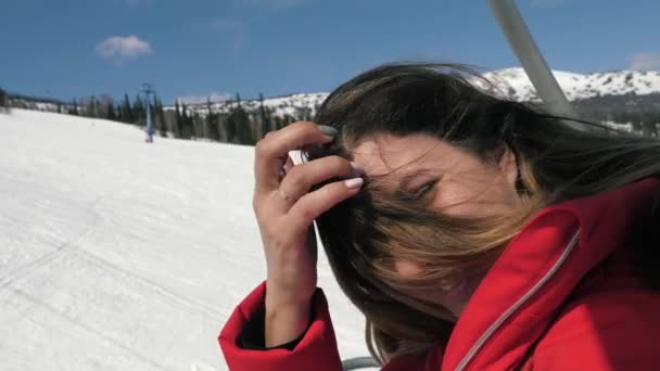 Portrait Of Caucasian Woman Smiling At Camera While Sitting On A Ski Lift — Stock Video