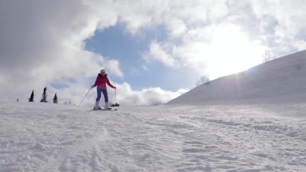 Mountain Skier Skiing On Snowy Mountainside In Resort On Sunny Day At Winter — Stock Video