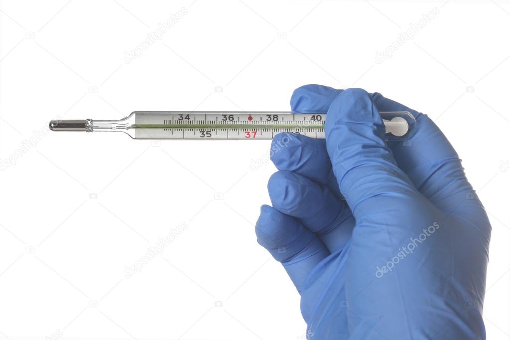 Hand in a blue glove holding a mercury thermometer isolated on w