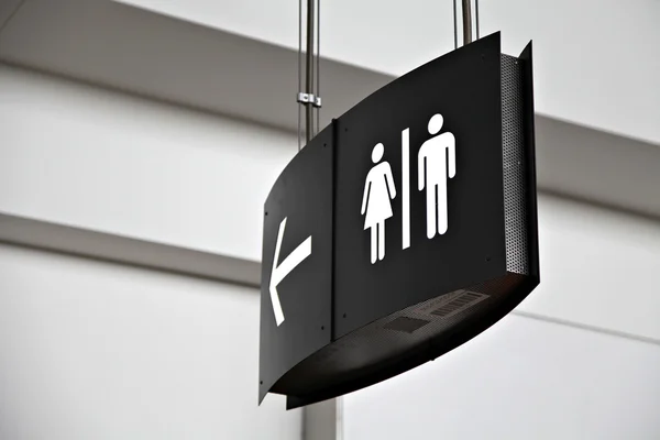 Airport washroom sign, shallow focus — Stock Photo, Image