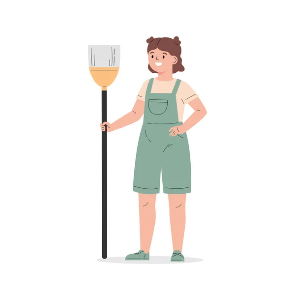 Young girl dressed in overalls with a broom. — Stock Vector
