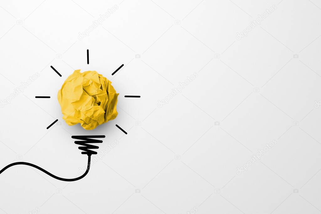 Creative thinking ideas and innovation concept. Paper scrap ball yellow colour with light bulb symbol on white background