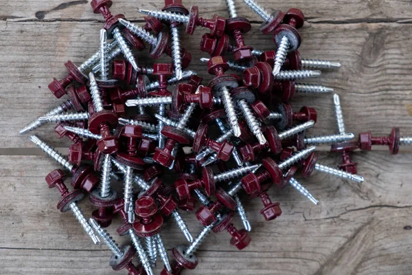 Red Self Drilling Roofing Screws Wooden Background — Stock Photo, Image