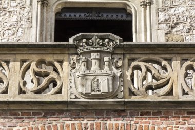  Coat of arms of Cracow- stone carving on Florian Gate in Cracow clipart