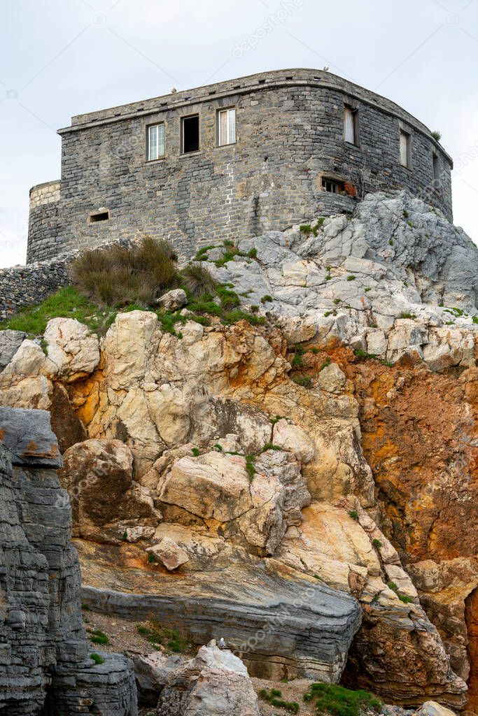 View of ruins of Doriow Castle over Byron Grotto in the Bay of Poets, Portovenere, Italian Riviera, Italy