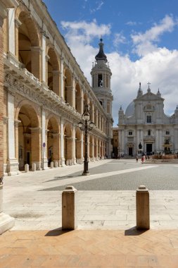 Loreto, Italy - June 11, 2025: Madonna Square with 16th century Basilica of the Holy House, bell tower and Illyrian Palace. Holy House Sanctuary is major Catholic pilgrimage destination in Italy