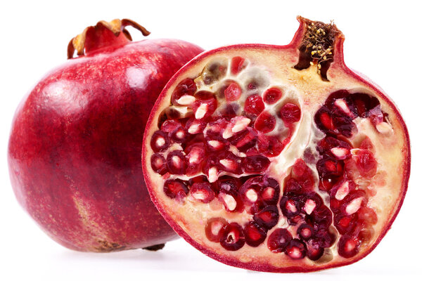 some fruits of red pomegranate isolated on white background, clo