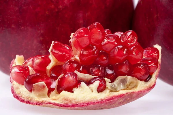 Piece of fruit of red pomegranate, close up — Stock Photo, Image