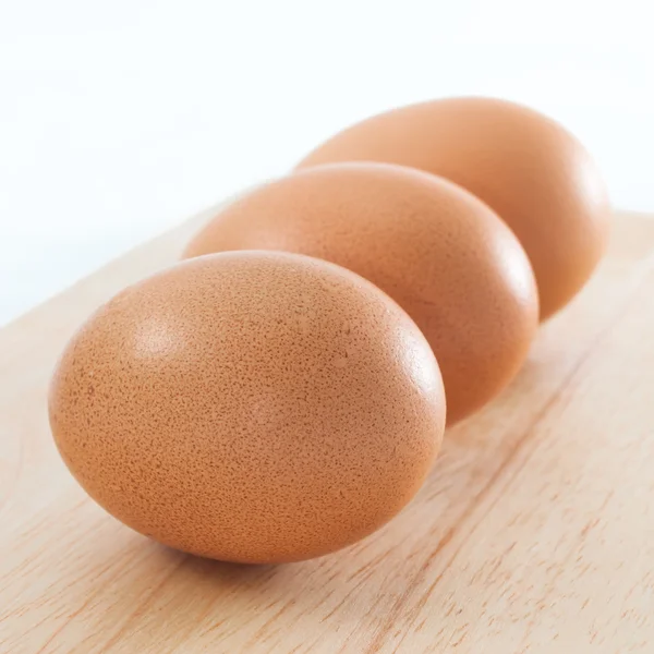 Hen chicken layers uncoocked eggs three close up square composition — Stock Photo, Image