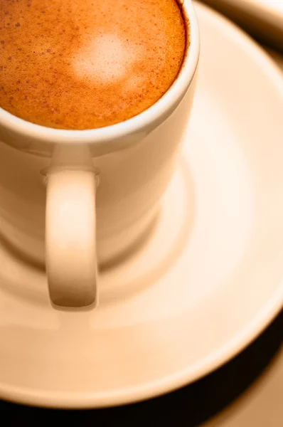 Ekspres do kawy filiżanka Zamknij się makro ciepły kolor koncepcja — Zdjęcie stockowe
