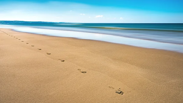 Aberdovey Aberdyfi Wales Snowdonia UK vast beautiful seascape holiday destination footprints on the sand horizontal — Stock Photo, Image