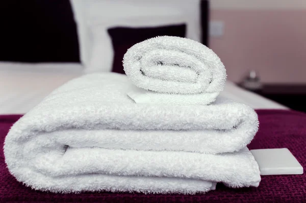 Closeup clean towels and soap in hotel room hygiene and hospitality concept Royalty Free Stock Photos