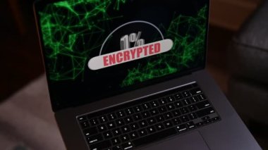 Laptop computer with percentage encryption on screen by ransomware