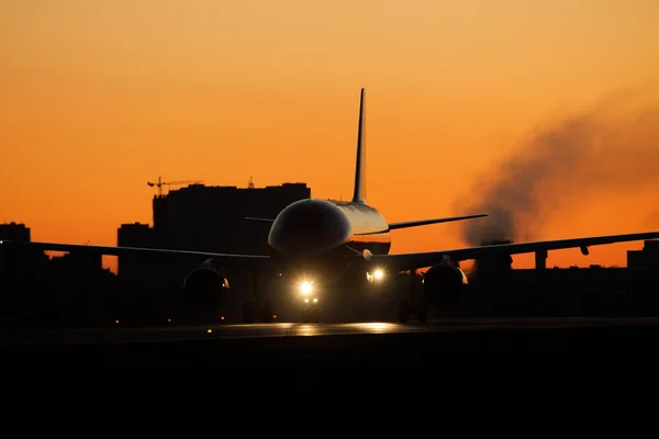 Plane on sunset — Stock Photo, Image