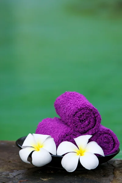 Frangipane and purple spa towels. Stock Image