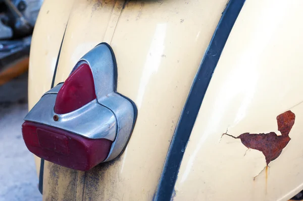 Old vespa wheel on back — Stock Photo, Image