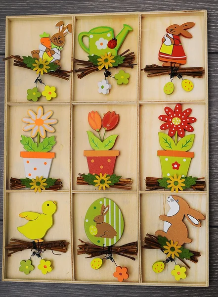 Easter eggs and decoration on wooden background — Stock Photo, Image