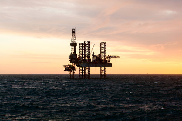 Oil platform at sunset