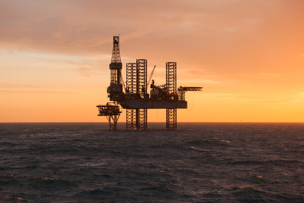 Oil platform at sunset