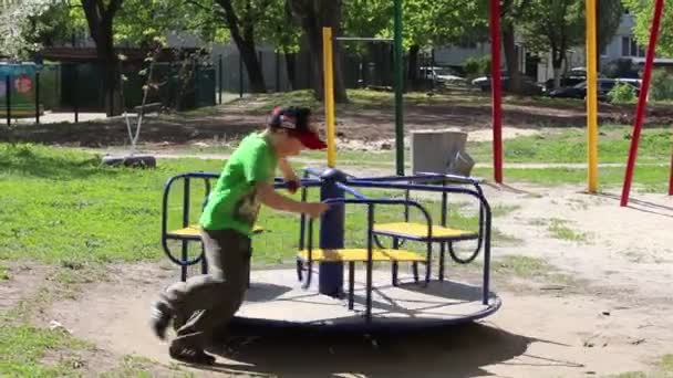 Boy Riding Carousel Rest Playground — Stock Video