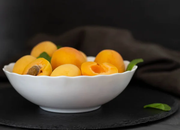 Fresh fruits. Healthy food. Mixed fruit, apricots and peaches. Studio photography of various fruits on an old wooden table. Organic healthy assorted fruits. Assortment of fresh fruit.