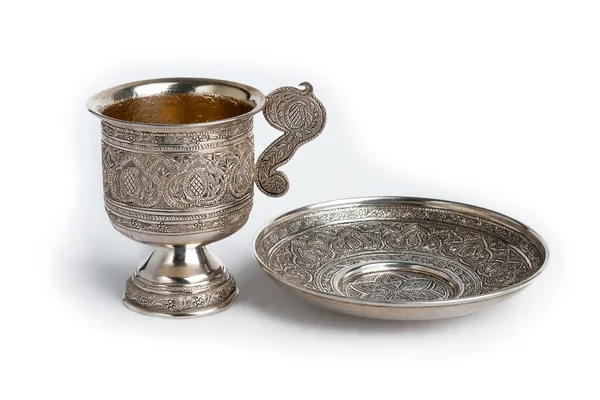 Silver cup and saucer Stock Image