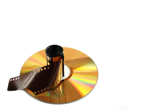 Filmrol en compact disk op witte achtergrond — Stockfoto