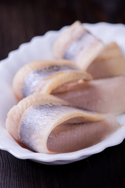 Herring on white ceramic plate — Stock Photo, Image