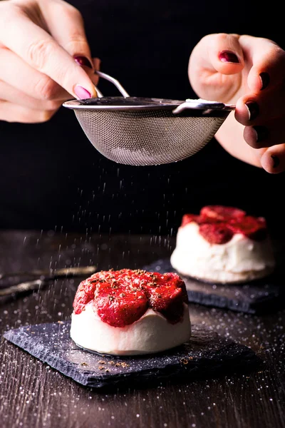 Cheese dessert with strawberry on black background Stock Photo