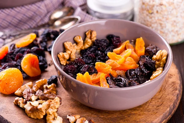 Oatmeal with raisins, dried apricots, plums — Stock Photo, Image