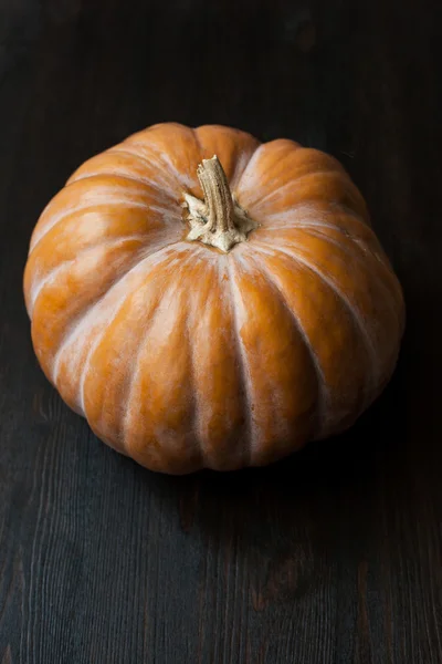 Large pumpkins on a wooden table, decor — Stock Photo, Image