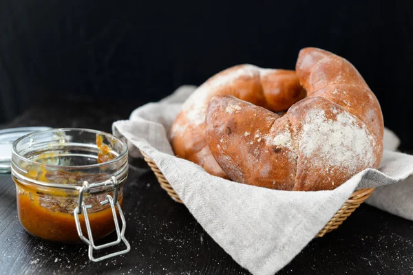 Delicious breakfast with fresh croissants and jam — Stock Photo, Image