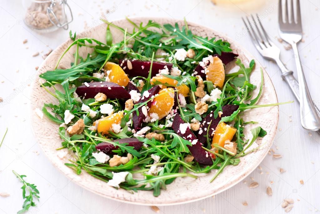 fresh salad with beetroot, arugula and mandarins