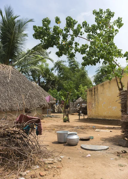 View through a group of humble dwellings in village. — Stock Photo, Image