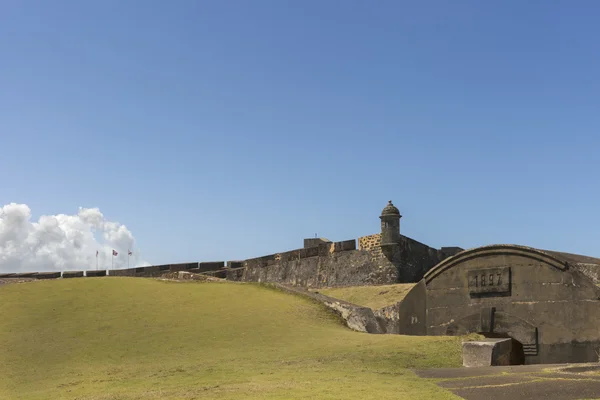 Northeastern lookout tower with flags and bunker. — Stock Photo, Image