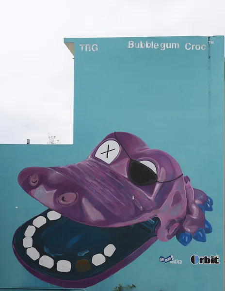 Graffiti of wide open purple crocodile mouth. — Stock Photo, Image