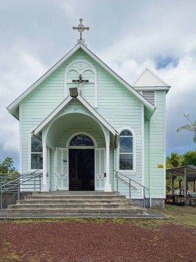 Kalapana, Pahoa, Hawaii, USA. - July 15, 2025: Star of the Sea Catholic Church. Frontal view with entrance under gray cloudscape