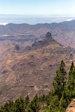 Roque Bentayga in Gran Canaria view from the rocks of Roque Nublo (Bulutlardaki Kaya)).