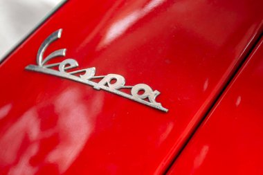 Florence, Italy - May 7, 2010: A red Vespa on a summer day in the streets of Florence.