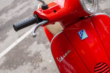 Florence, Italy - May 7, 2010: A red Vespa on a summer day in the streets of Florence.