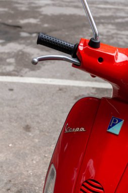 Florence, Italy - May 7, 2010: A red Vespa on a summer day in the streets of Florence.