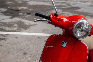 Florence, Italy - May 7, 2010: A red Vespa on a summer day in the streets of Florence.