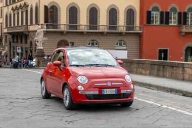 Florence, Italy - May 7, 2010: A Fiat 500 on a summer day in the streets of Florence.