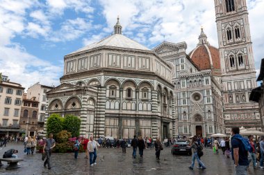 Florence, Italy - May 8, 2010: Florence, Italy - May 8, 2010: Baptistery of San Giovanni at the Cathedral of Saint Mary of the Flower on a cloudy summer day in Florence, Italy.