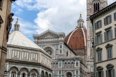 Baptistery of San Giovanni at the Cathedral of Saint Mary of the Flower on a cloudy summer day in Florence, Italy.