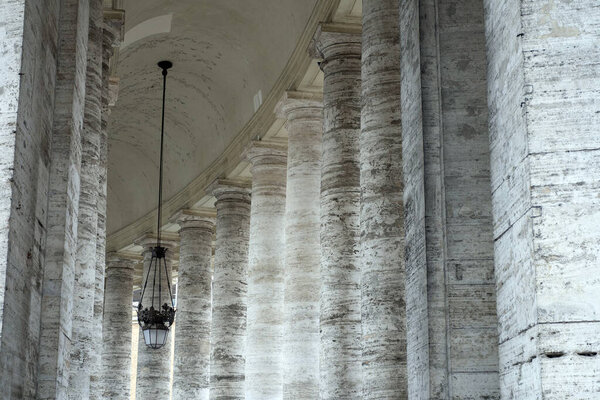 St. Peter's Square colonnades in Rome on a summer day.