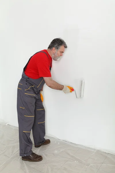 Worker painting  room to white — Stock Photo, Image